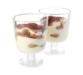 Photo of Delicious tiramisu in glasses isolated on white