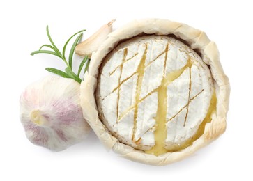 Photo of Tasty baked brie cheese, garlic and rosemary isolated on white, top view