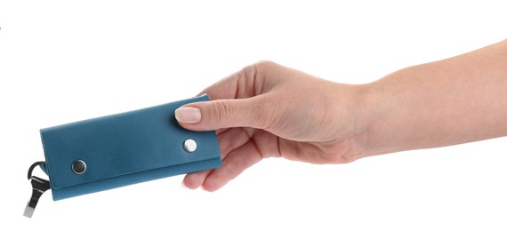 Photo of Woman holding stylish leather keys holder on white background, closeup