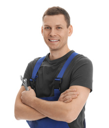 Photo of Portrait of professional auto mechanic with wrenches on white background
