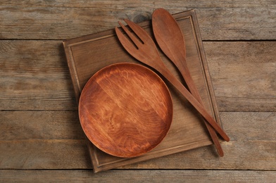 Photo of Cooking utensils on wooden table, flat lay