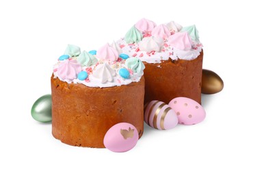 Photo of Traditional Easter cakes with meringues and painted eggs isolated on white