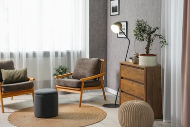Photo of Home renovation. Room interior with stylish gray wallpaper on wall