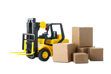 Photo of Toy forklift with boxes isolated on white. Logistics and wholesale concept
