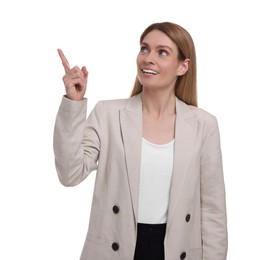 Photo of Beautiful happy businesswoman pointing at something on white background