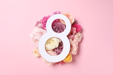 Photo of 8 March greeting card design with beautiful roses on light pink background, top view