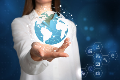 Travel agency services. Woman demonstrating world globe 