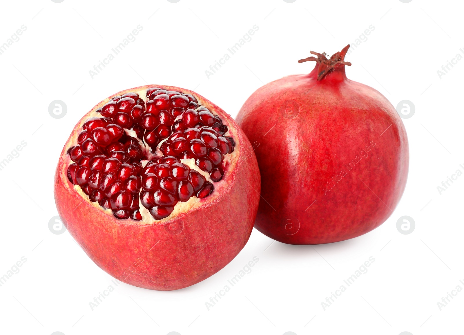 Photo of Two fresh ripe pomegranates isolated on white