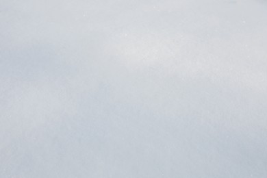Photo of Clear white snow as background, closeup. Winter season