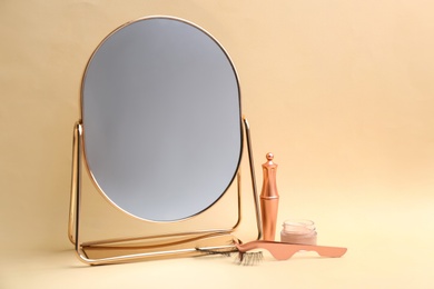 Photo of Magnetic eyelashes and accessories on beige background. Space for text
