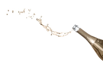 Photo of Sparkling wine splashing out of bottle on white background