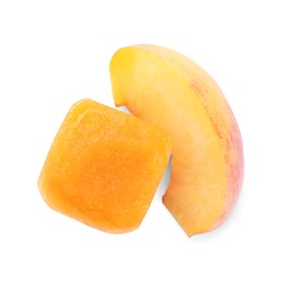Photo of Frozen nectarine puree cube and fruit on white background, top view