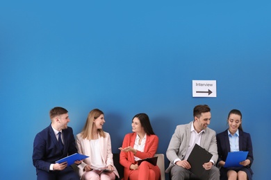 Photo of Group of people waiting for job interview, indoors