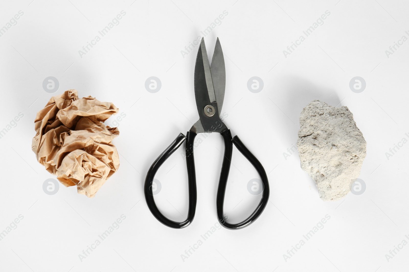 Photo of Rock, paper and scissors on white background, top view