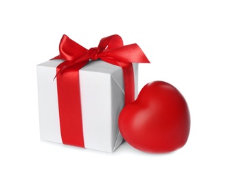Photo of Beautiful gift box and red heart on white background. Valentine's Day celebration