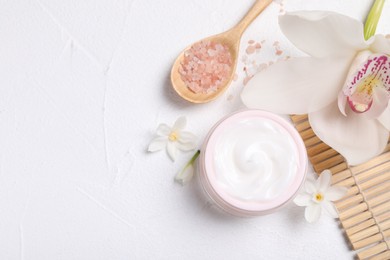 Photo of Beautiful spa composition with cosmetic products and flowers on white table, flat lay. Space for text