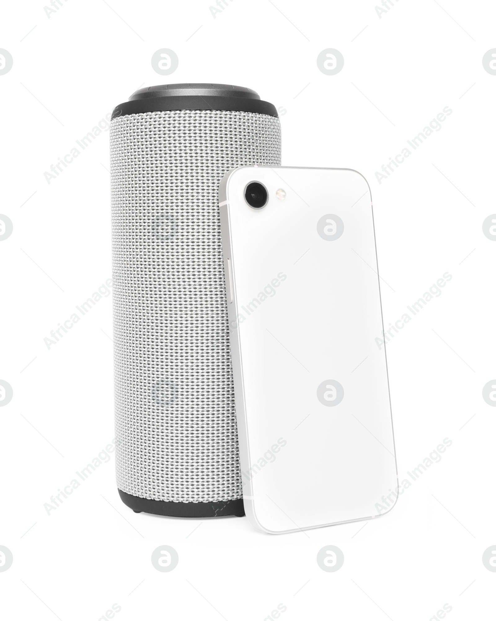 Photo of Portable bluetooth speaker and smartphone isolated on white. Audio equipment