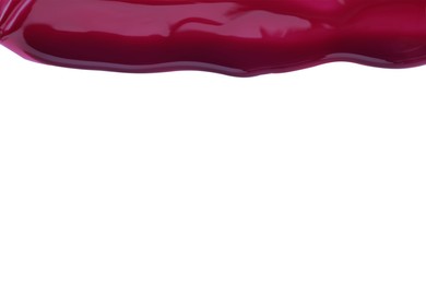 Photo of Burgundy nail polish flowing on white background