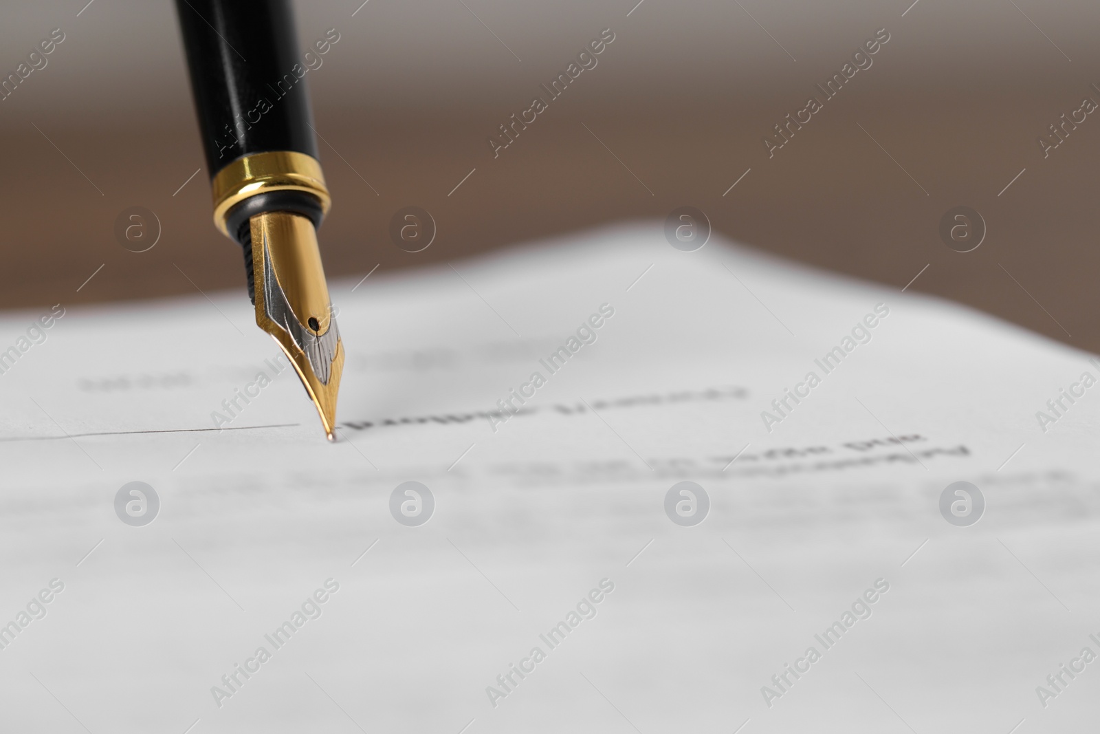 Photo of Writing on document with fountain pen, closeup and space for text. Notary contract