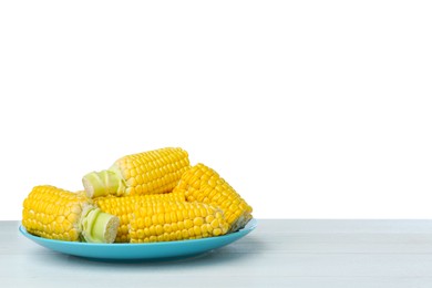 Tasty corn cobs on wooden table against white background