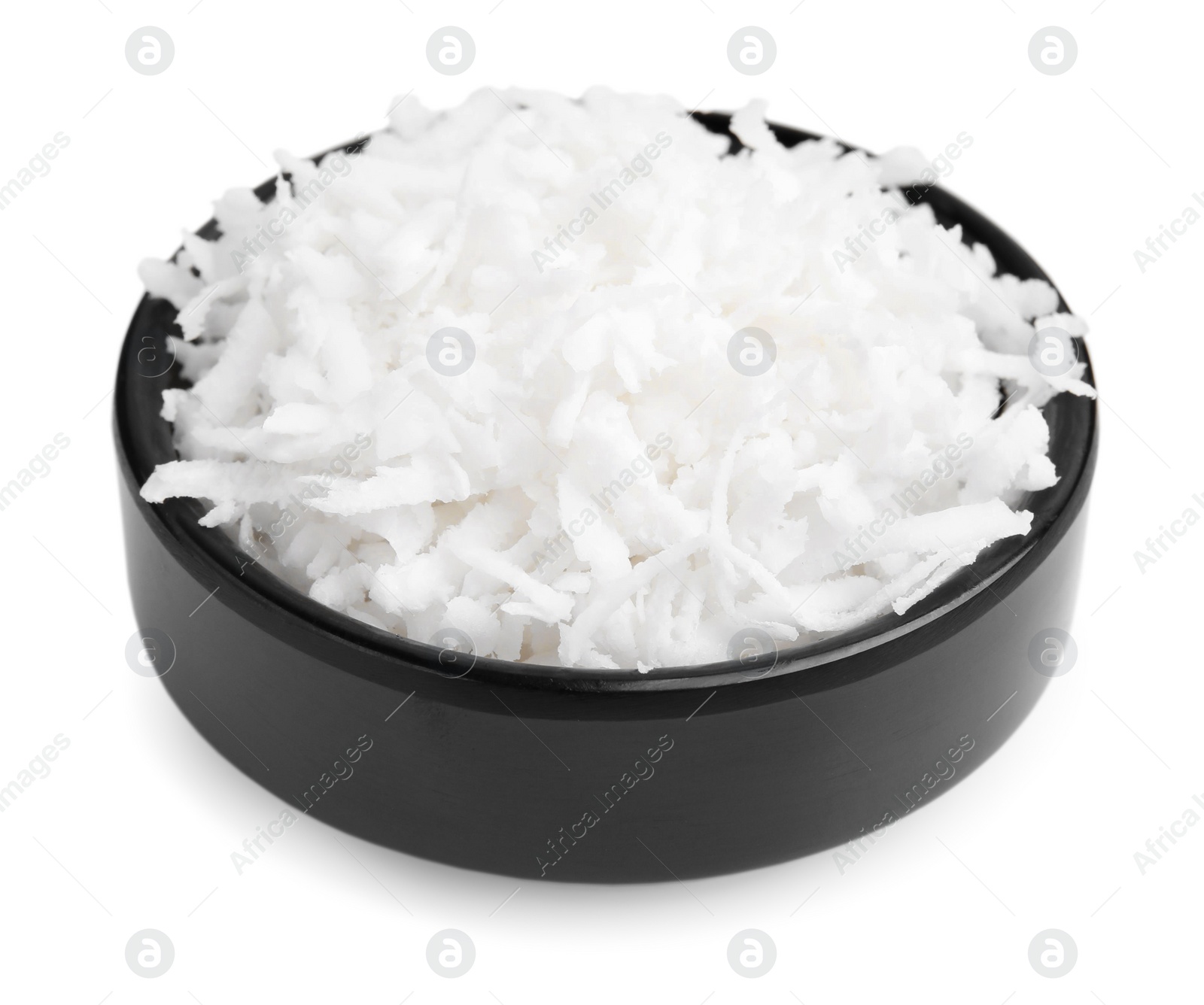 Photo of Coconut flakes in bowl isolated on white