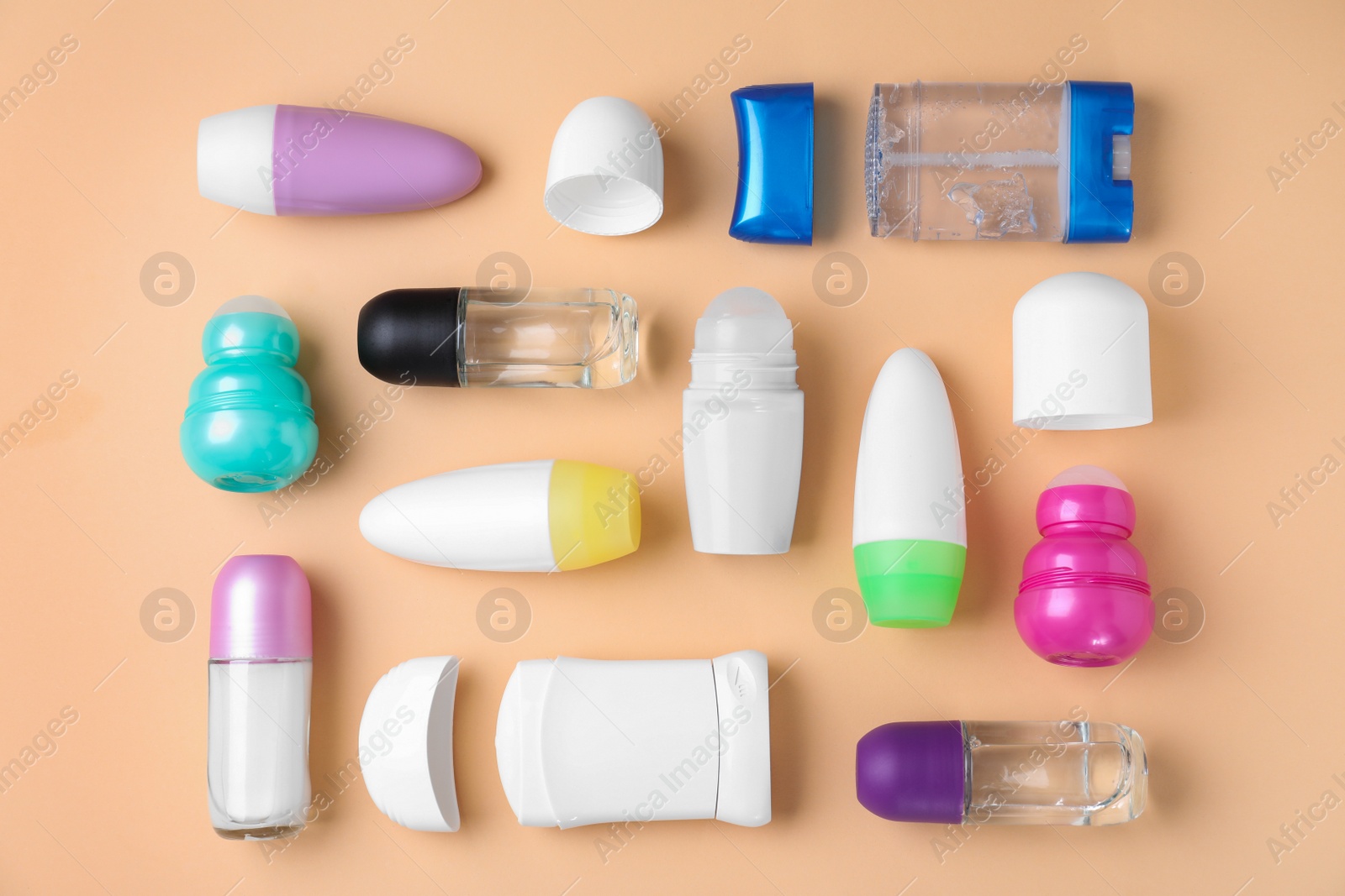 Photo of Flat lay composition with different natural deodorants on beige background