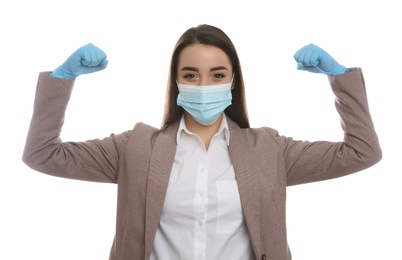 Photo of Businesswoman with protective mask and gloves showing muscles on white background. Strong immunity concept