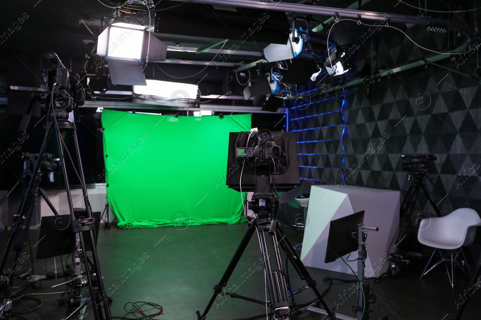 Photo of Modern video recording studio with professional cameras