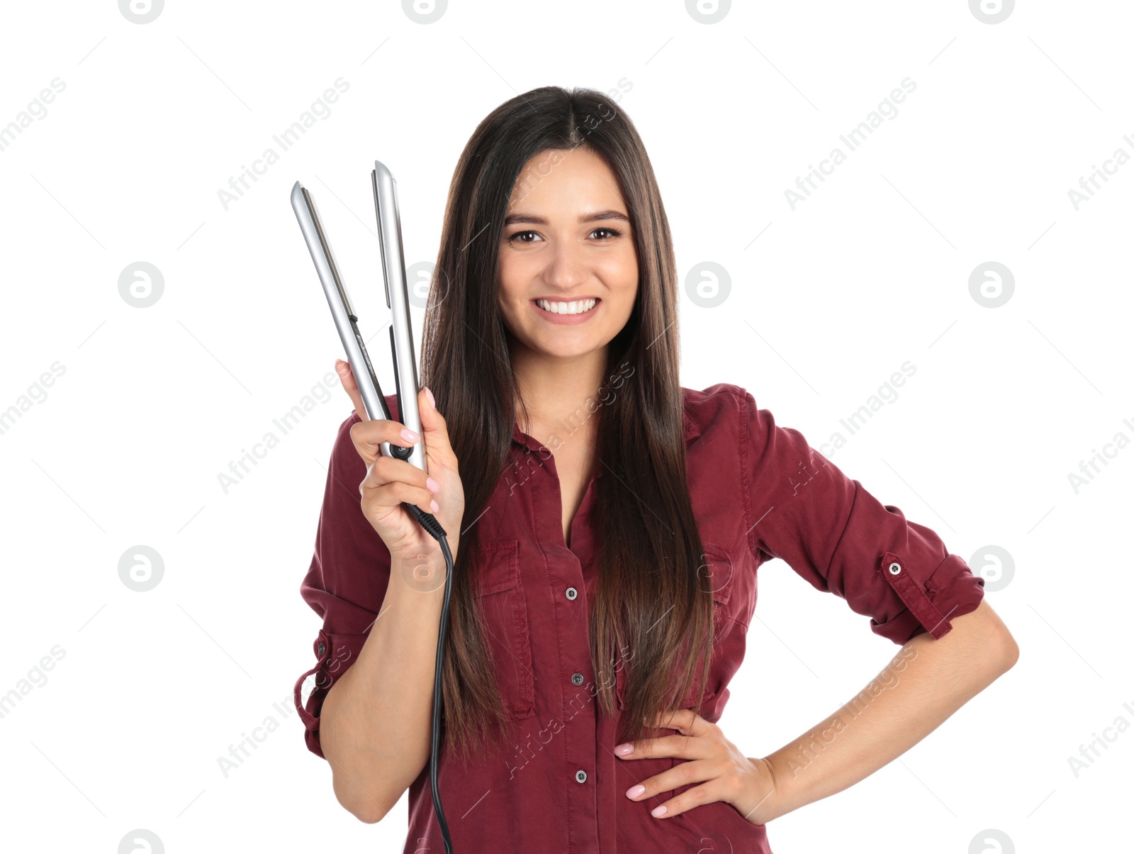 Photo of Young woman with modern hair iron on white background