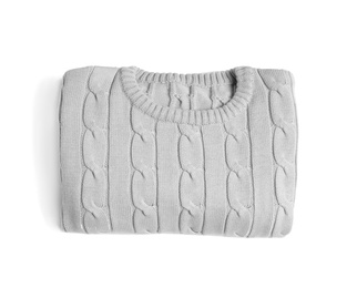 Photo of Folded knitted sweater on white background, top view