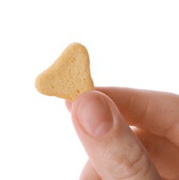 Woman holding crispy rusk on white background, closeup