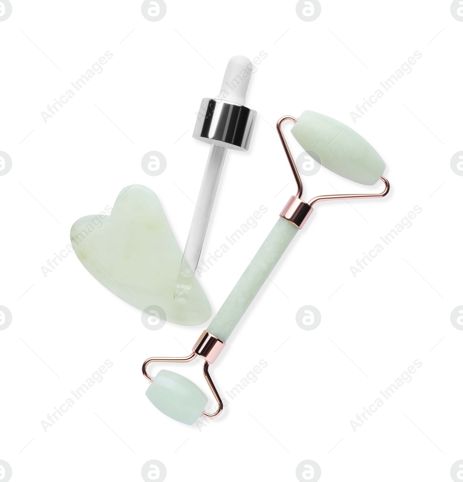 Photo of Jade gua sha tool, facial roller and dropper isolated on white, top view
