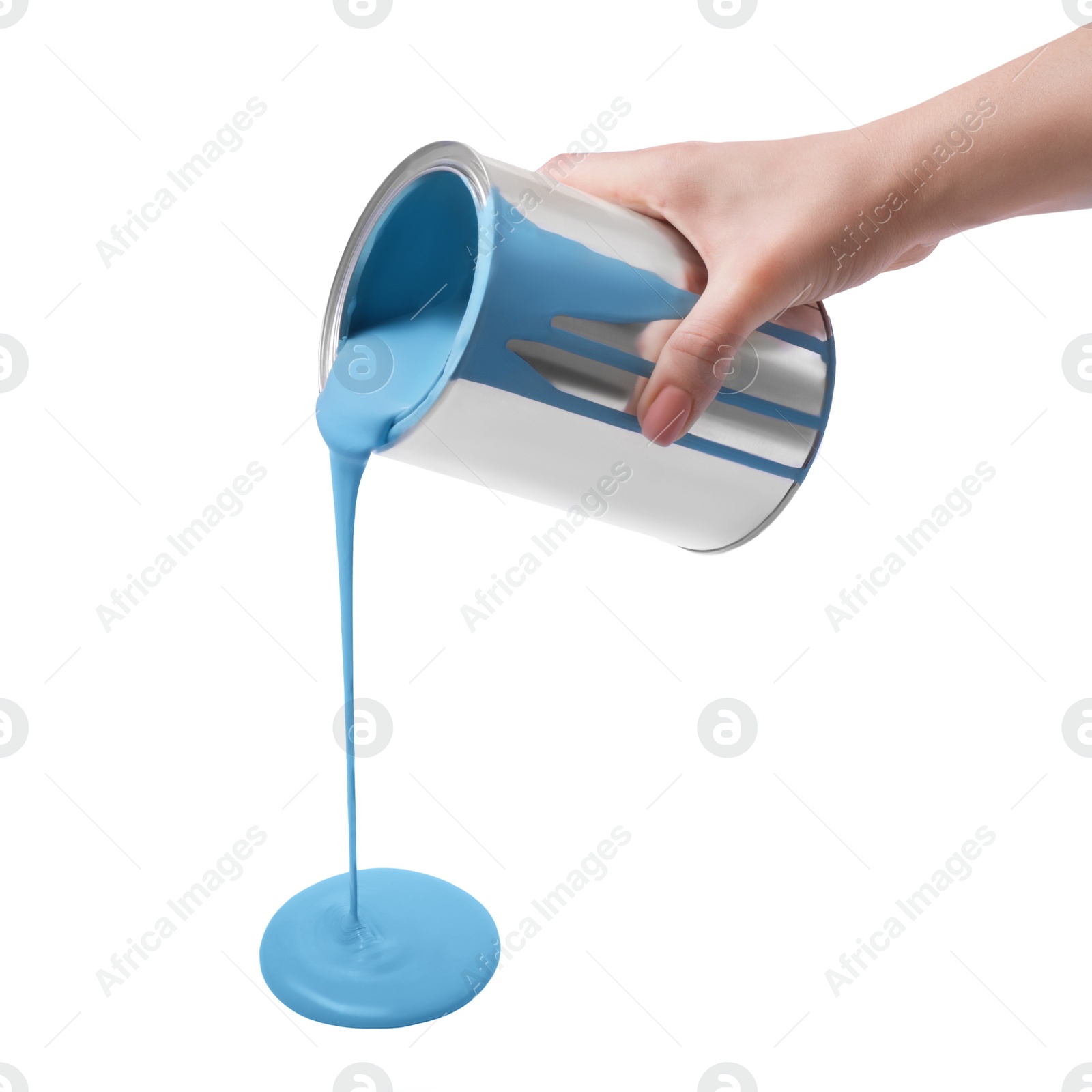 Photo of Woman pouring light blue paint from can on white background, closeup