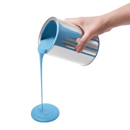 Woman pouring light blue paint from can on white background, closeup