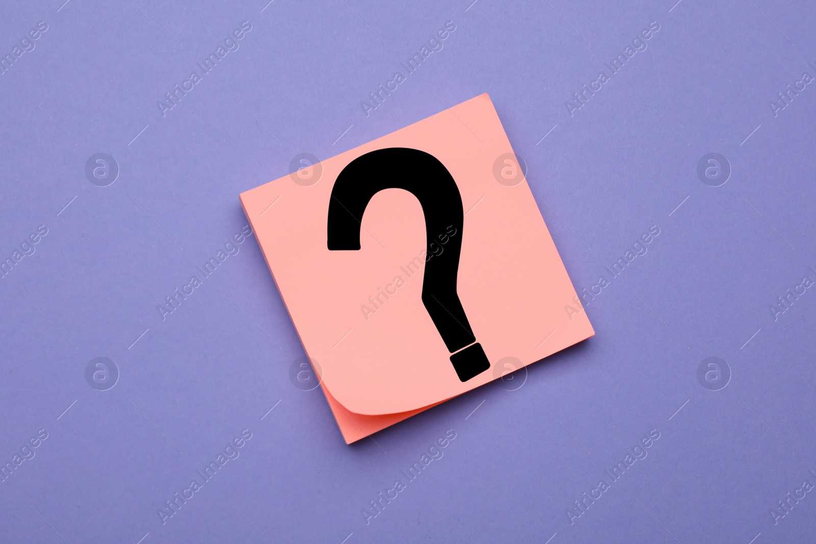 Photo of Sticky note with question mark on violet background, top view