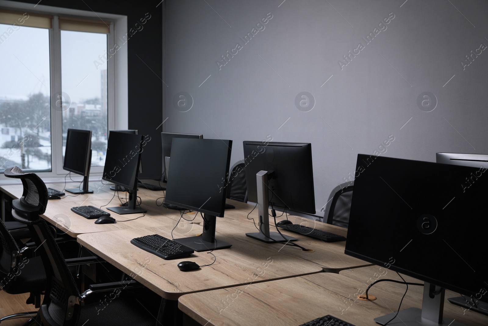 Photo of Many modern computers in open space office