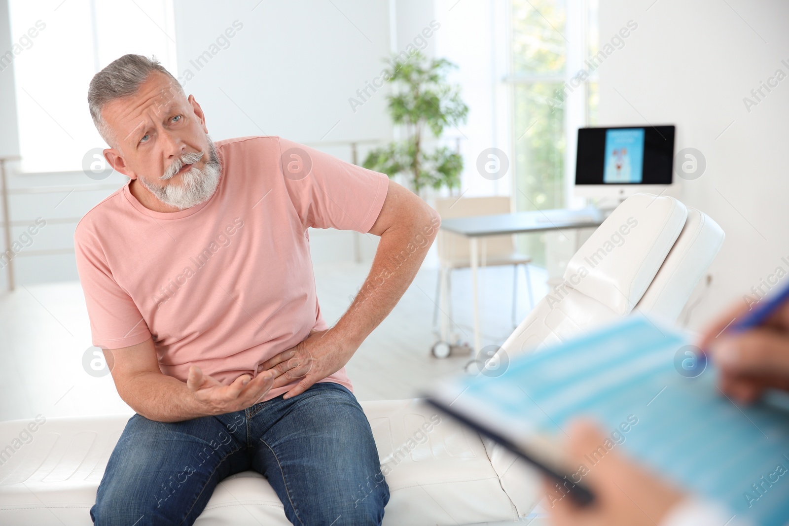 Photo of Man with health problem visiting urologist at hospital