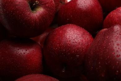 Photo of Fresh red apples with water drops as background, closeup