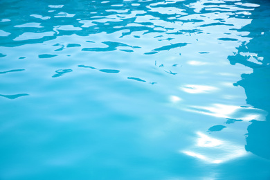 Photo of Clear water in swimming pool as background, closeup