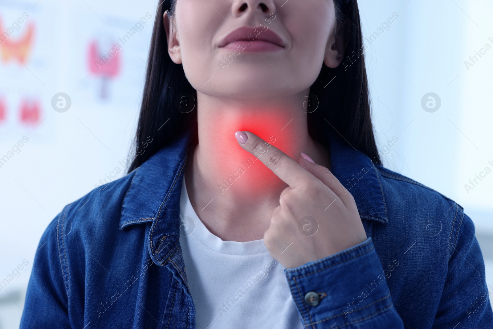 Image of Endocrine system. Woman doing thyroid self examination indoors, closeup