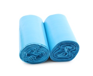 Photo of Two rolls of light blue garbage bags isolated on white