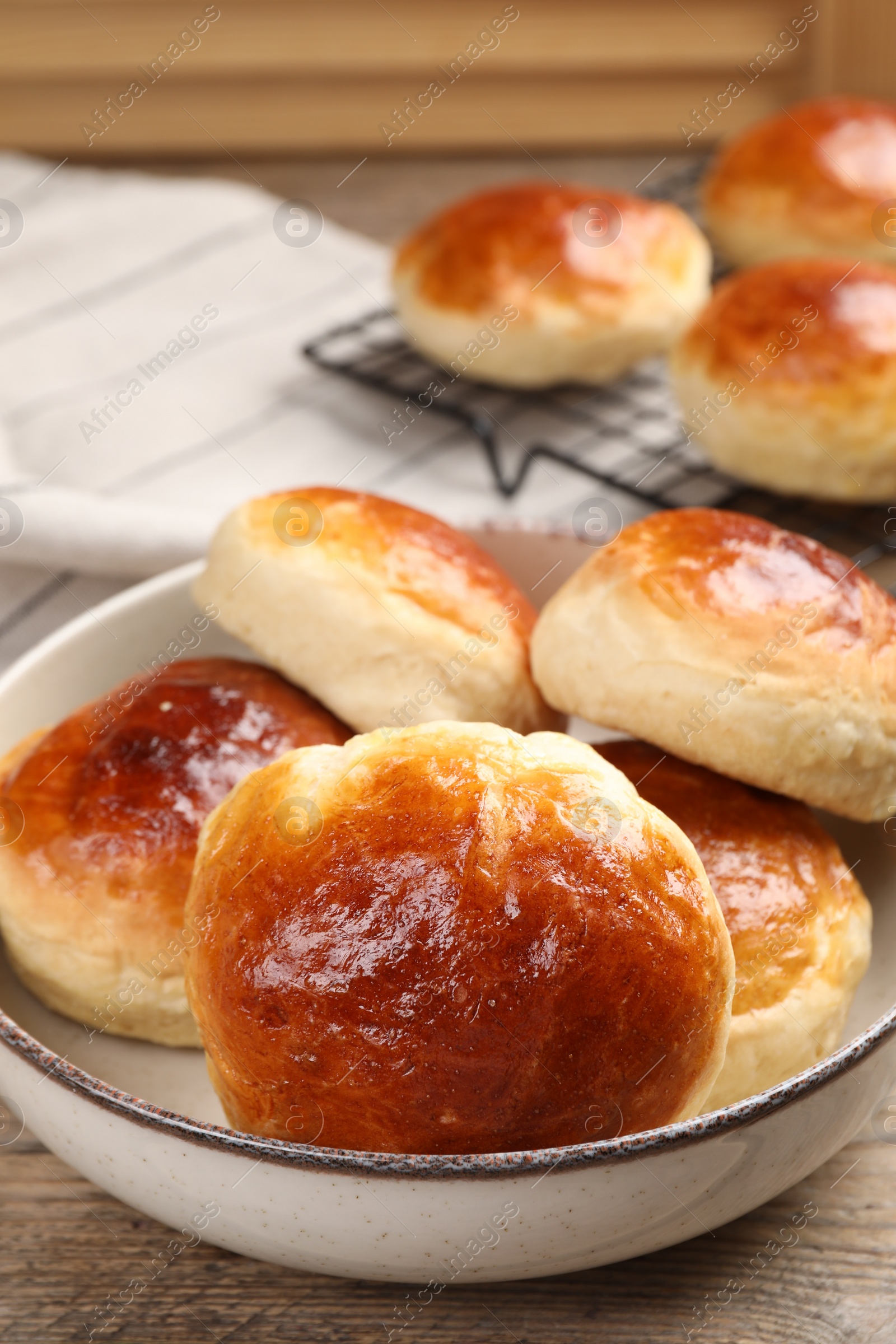 Photo of Tasty scones prepared on soda water on wooden table