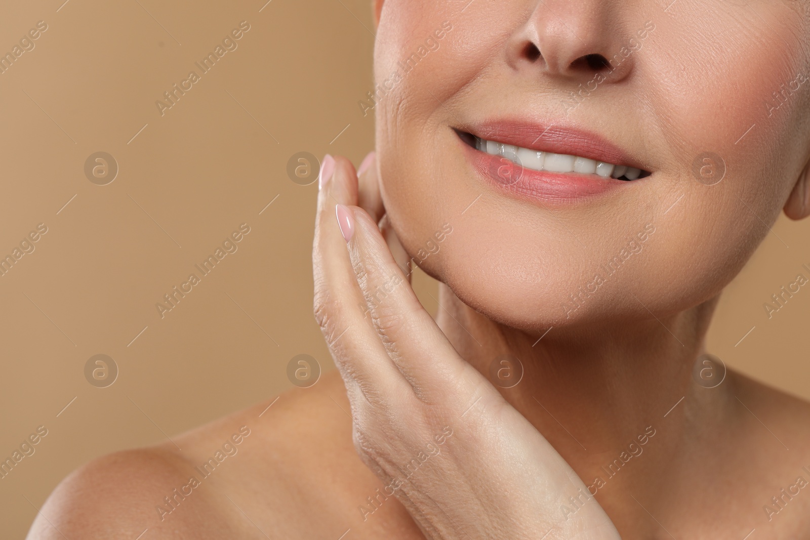 Photo of Woman with healthy skin on beige background, closeup. Space for text