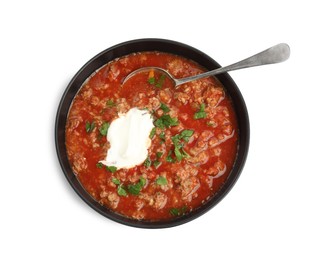 Photo of Bowl of delicious stuffed pepper soup on white background, top view