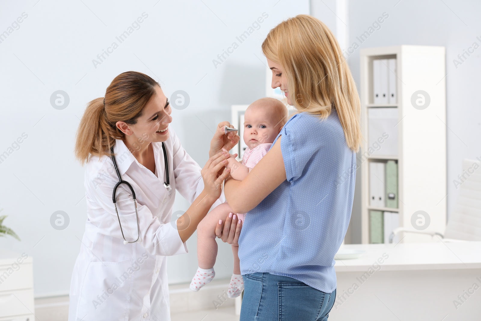 Photo of Woman with her baby visiting children's doctor in hospital