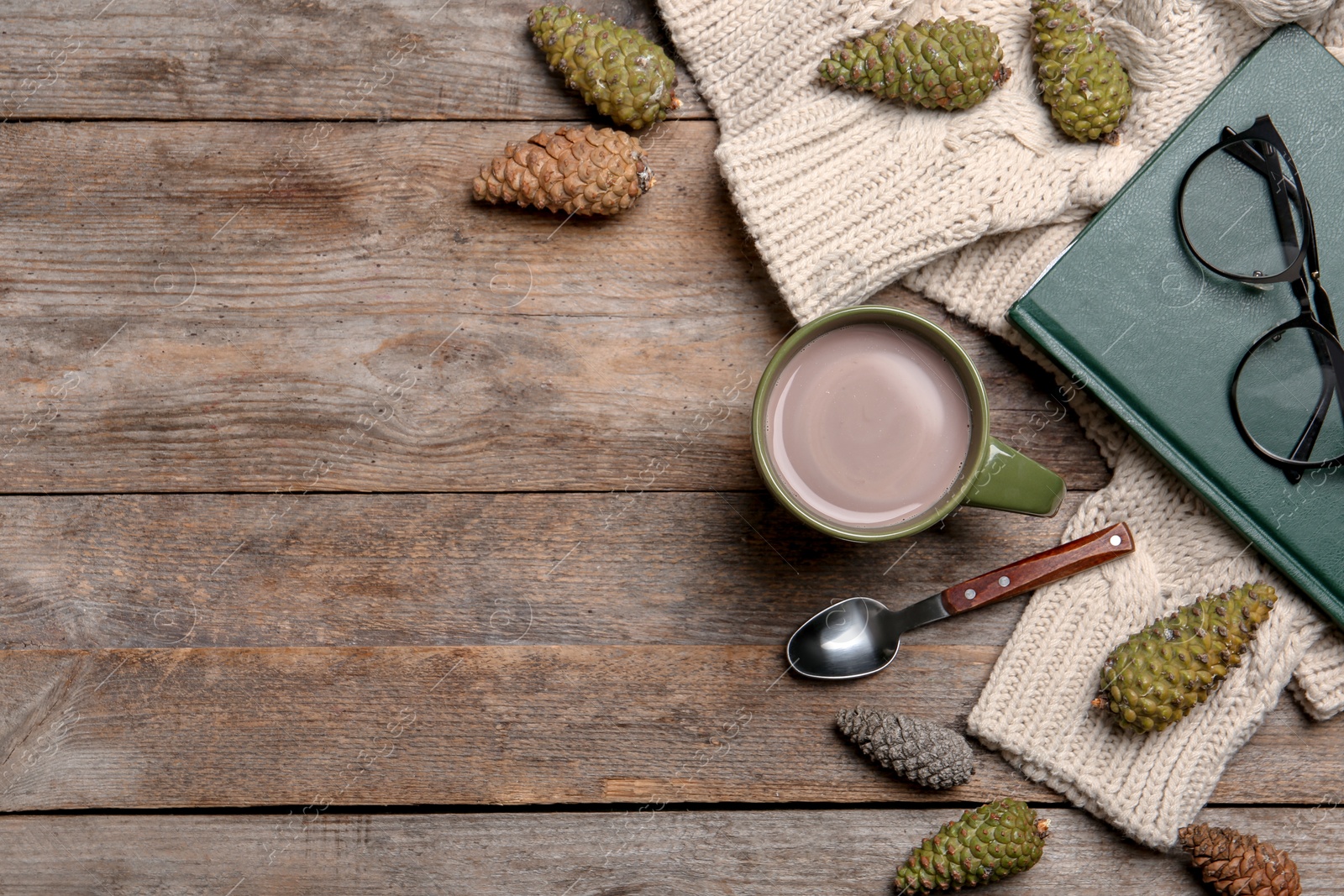 Photo of Flat lay composition with hot cozy drink and autumn sweater on wooden background. Space for text