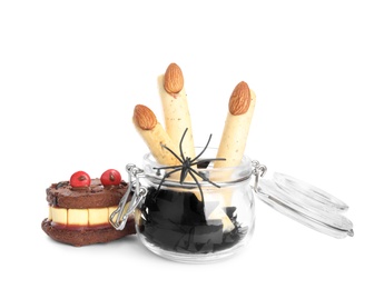 Photo of Delicious desserts decorated as monster fingers on white background. Halloween treat