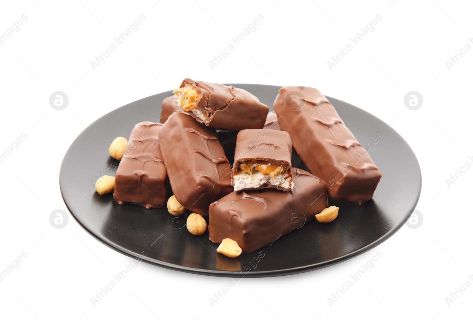 Photo of Plate of chocolate bars with caramel, nuts and nougat isolated on white