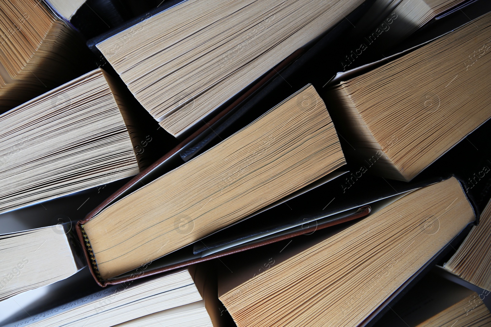 Photo of Collection of different books as background, top view