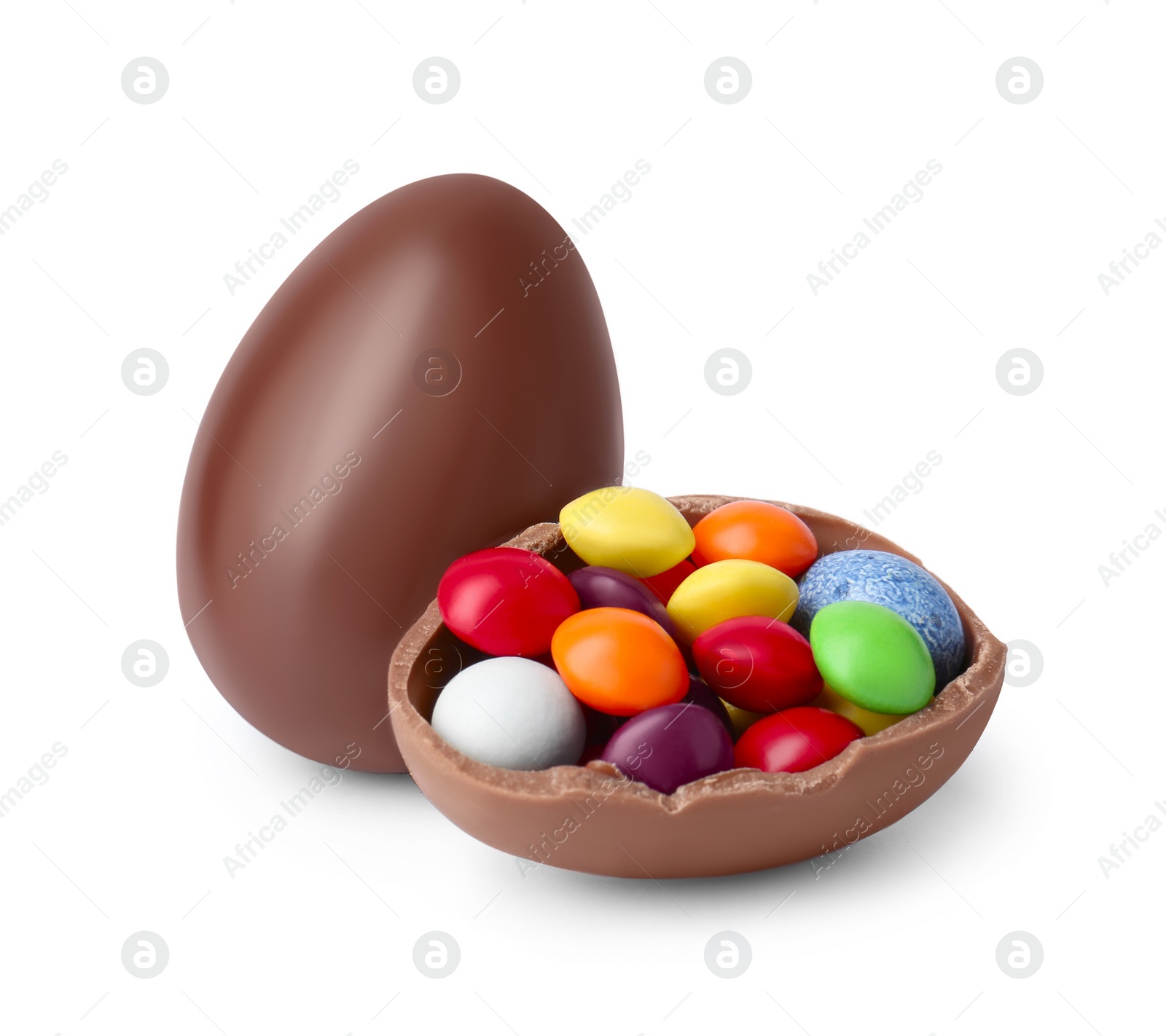 Photo of Whole and half of chocolate eggs with colorful candies isolated on white